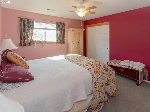 a bed room with a bed and a window