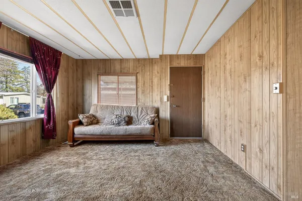 a view of an entryway with wooden door
