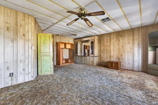 a large white kitchen with a large window