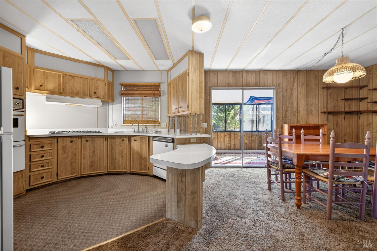 902 Corte Amarillo Rohnert Park, CA 94928 - Photo 16 of 31 a large kitchen with a table and chairs