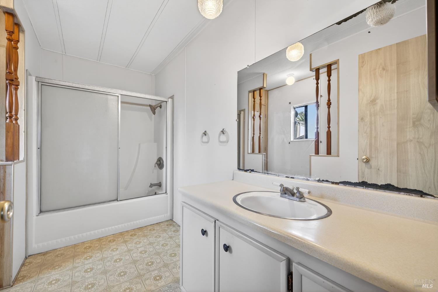 902 Corte Amarillo Rohnert Park, CA 94928 - Photo 24 of 31 a bathroom with a sink and a mirror