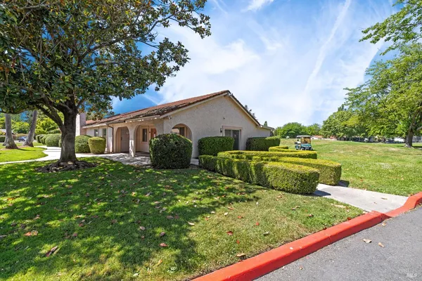 a view of a golf course with a lake