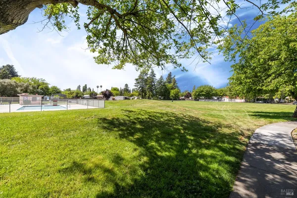 a view of a lake with houses in the background