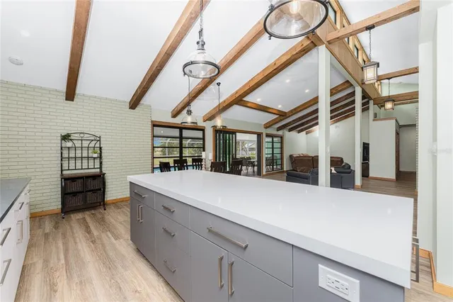 a kitchen with stainless steel appliances granite countertop a stove and a refrigerator