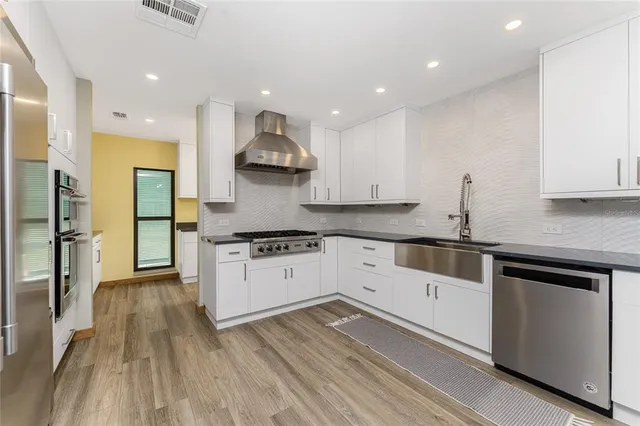 a bedroom with a bed and a ceiling fan