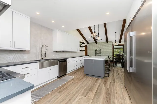 a bedroom with a large bed and a large window
