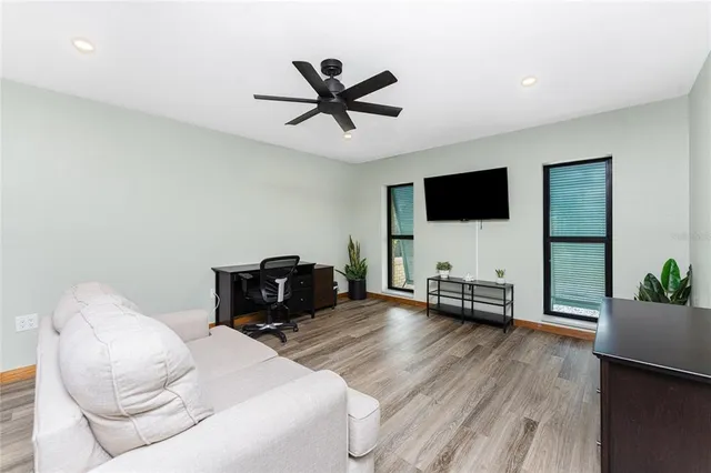 a spacious bedroom with a bed and a window