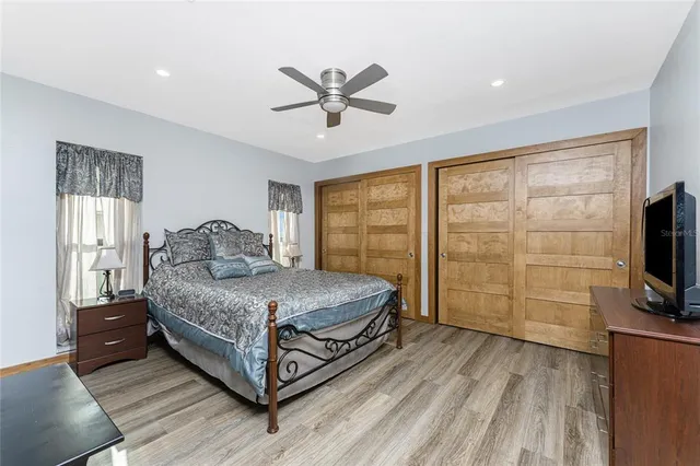 a swimming pool with outdoor seating and yard