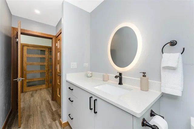 a view of a swimming pool with a patio and yard of the house