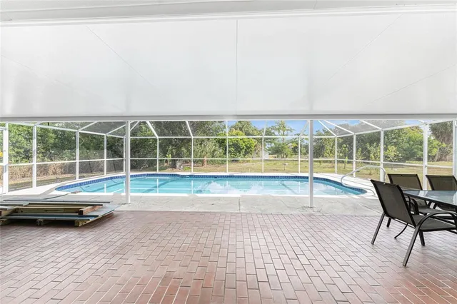 a view of a house with a yard and garage