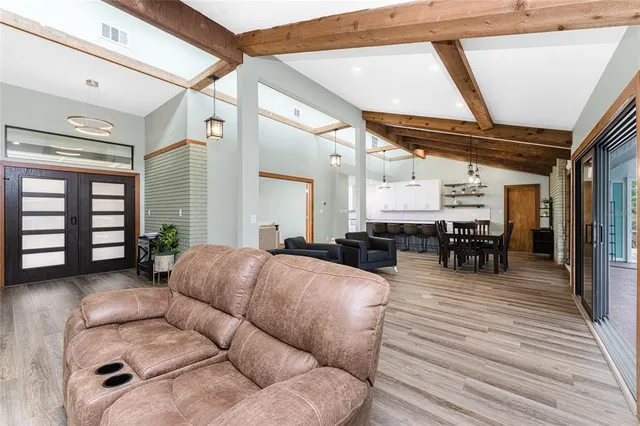 a view of a dining room with furniture window and wooden floor