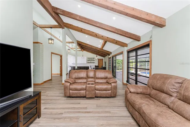 a large kitchen with stainless steel appliances kitchen island a large island in the center