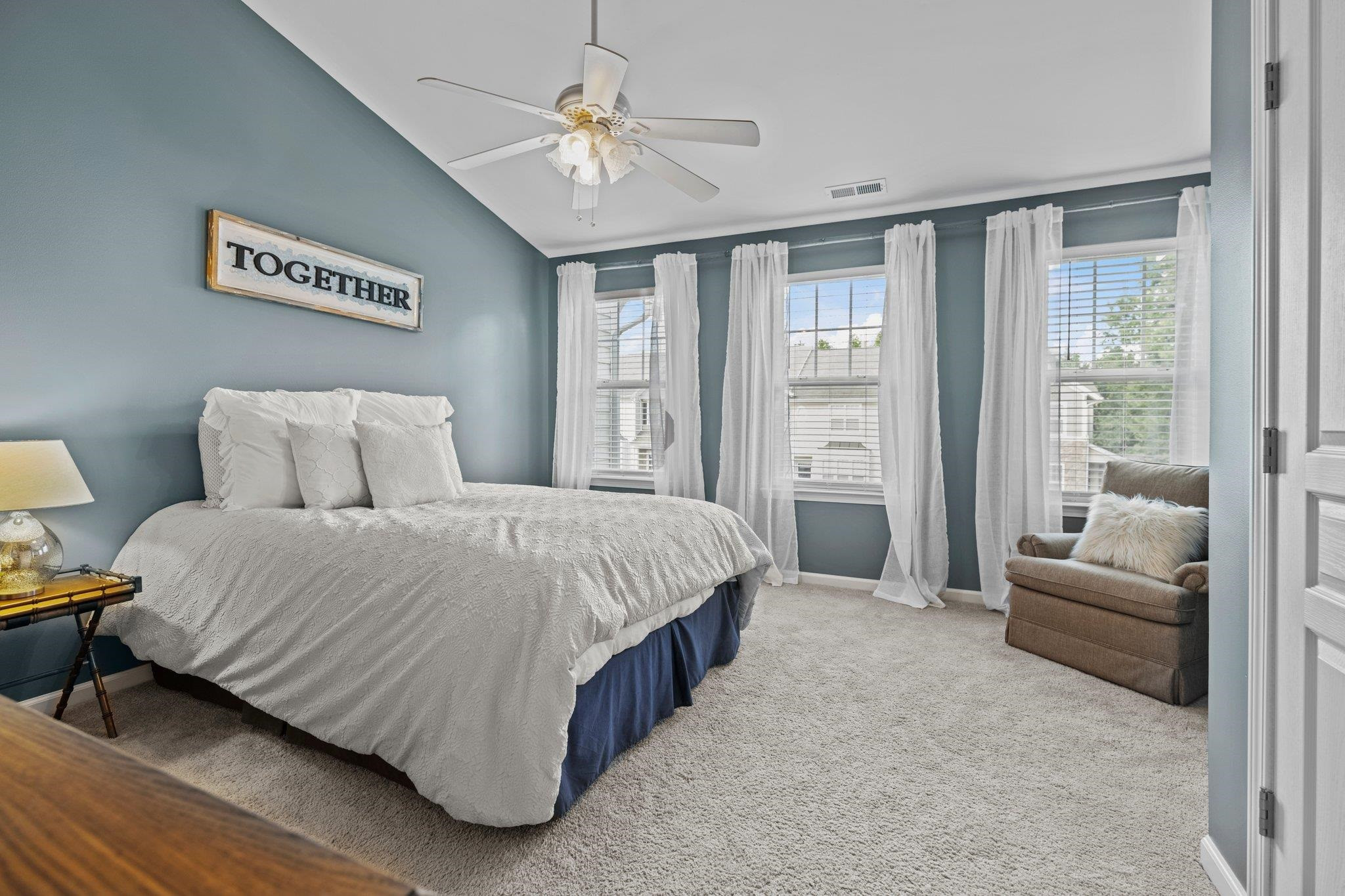 5105 Singing Wind Drive Raleigh, NC 27612 - Photo 11 of 21 Luxurious owners suite features vaulted ceilings, spacious closets, additional seating area and wall-to-wall windows for a glistening, expansive retreat. SPACIOUS OWNERS SUITE