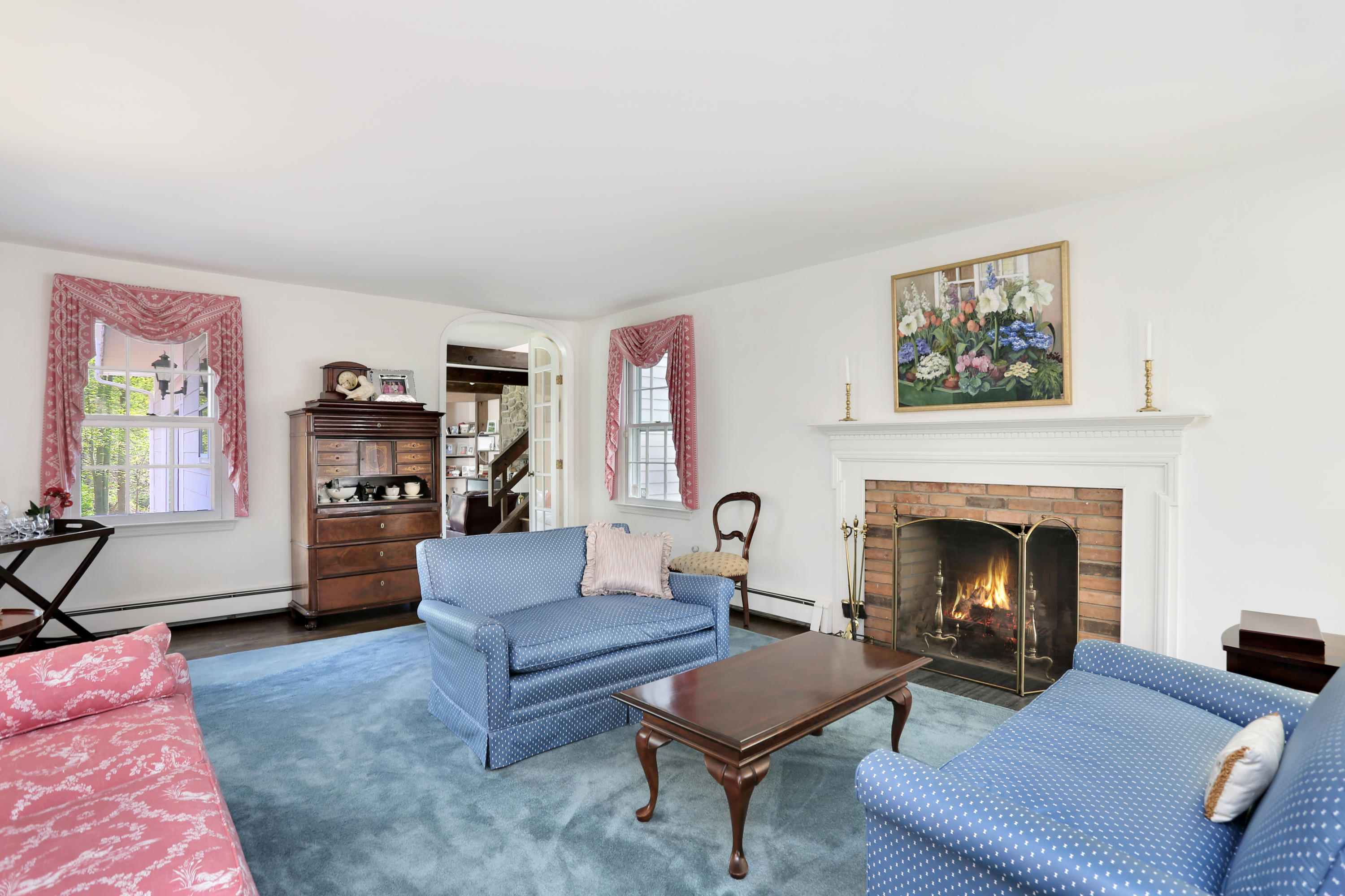 434 Ponus Ridge Road New Canaan, CT 06840 - Photo 3 of 19 a living room with furniture and a fireplace