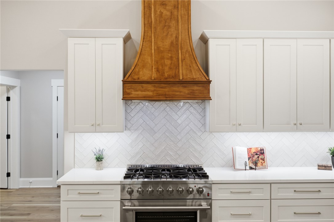 147 McAlister Road West Union, SC 29696 - Photo 9 of 49 This chef's kitchen features high-end appliances, ample counter space, and custom cabinetry.