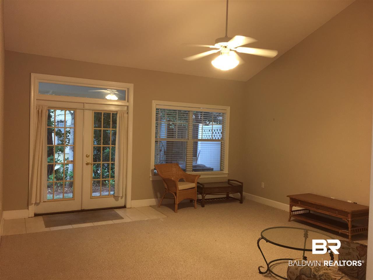430 West Fort Morgan Road, Unit 201 Gulf Shores, AL 36542 - Photo 4 of 30 LARGE LIVING ROOM, VAULTED CEILING & FRENCH DOORS
