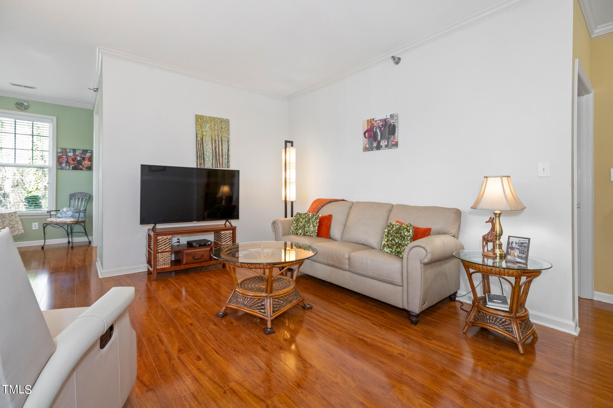 1700 Tiffany Bay Court, Unit 303 Raleigh, NC 27609 - Photo 11 of 30 a living room with furniture and a flat screen tv