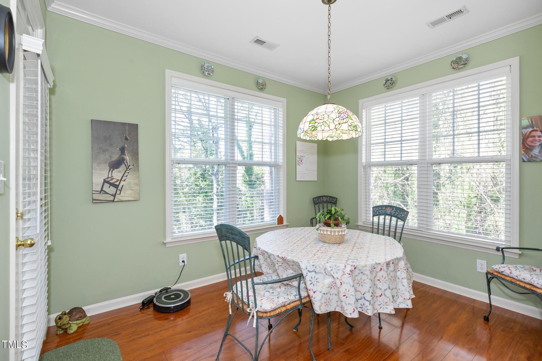 1700 Tiffany Bay Court, Unit 303 Raleigh, NC 27609 - Photo 12 of 30 a view of a dining room with furniture window and wooden floor