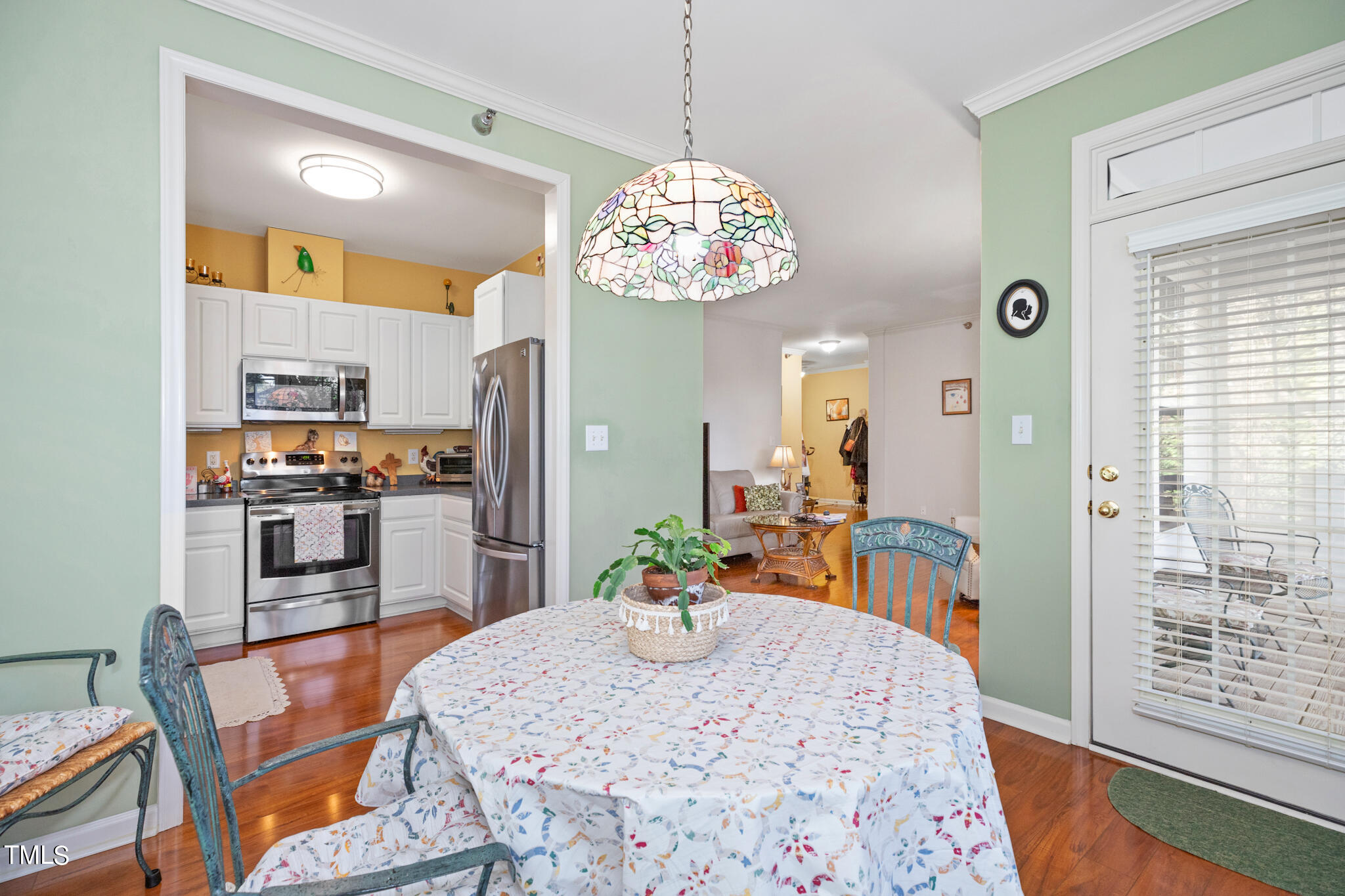 1700 Tiffany Bay Court, Unit 303 Raleigh, NC 27609 - Photo 13 of 30 a kitchen with a table and chairs in it