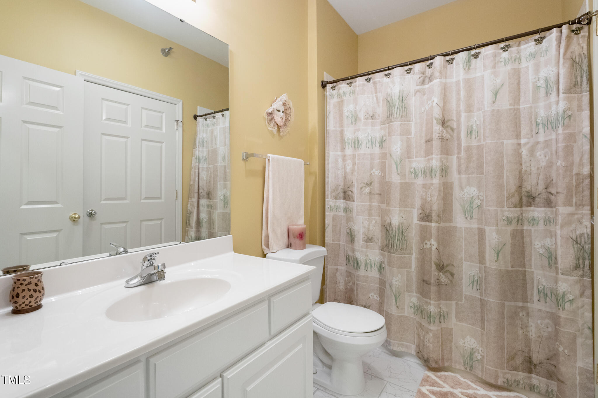 1700 Tiffany Bay Court, Unit 303 Raleigh, NC 27609 - Photo 22 of 30 a bathroom with a sink and a mirror