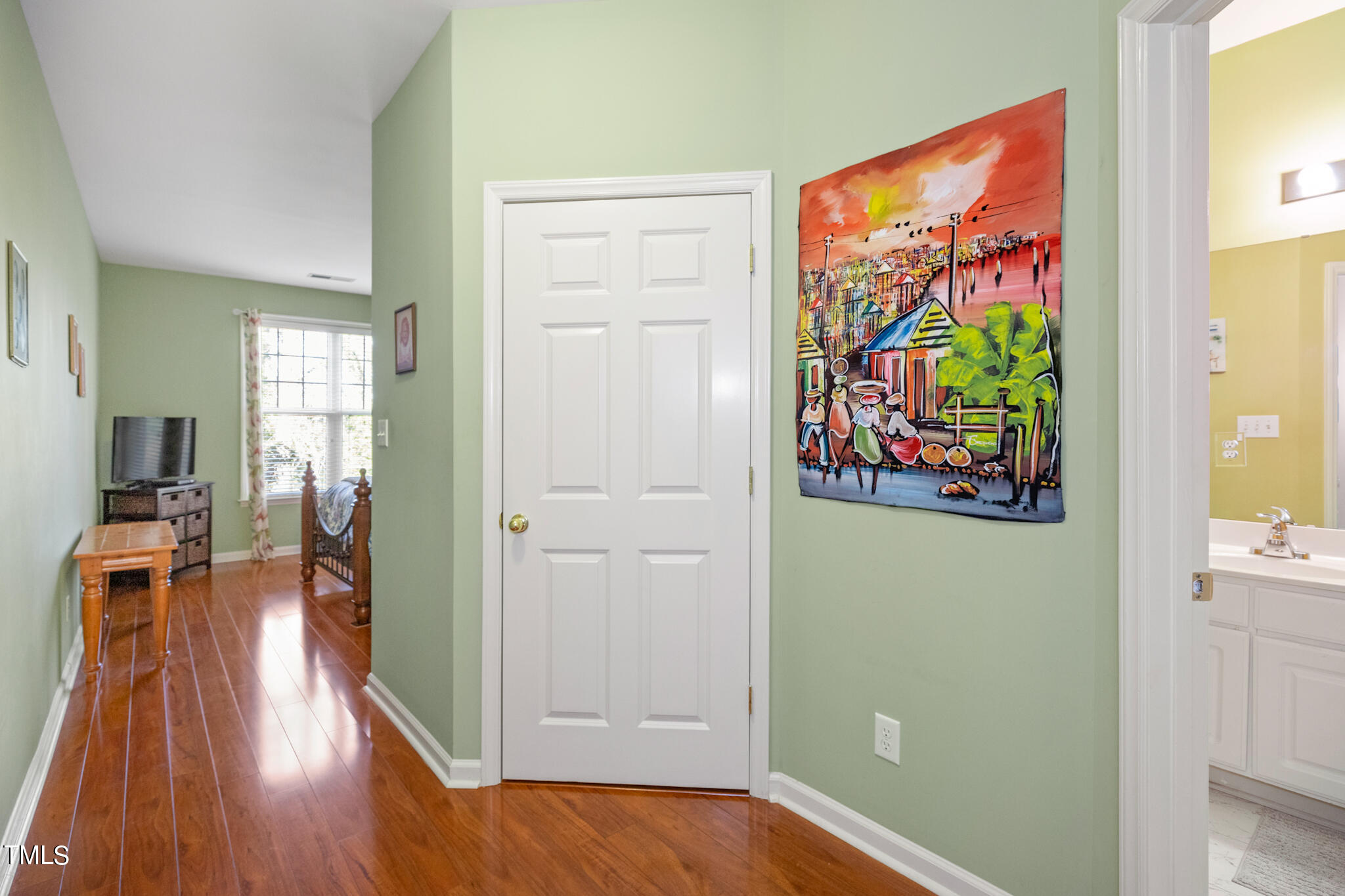 1700 Tiffany Bay Court, Unit 303 Raleigh, NC 27609 - Photo 27 of 30 hallway with wooden floor