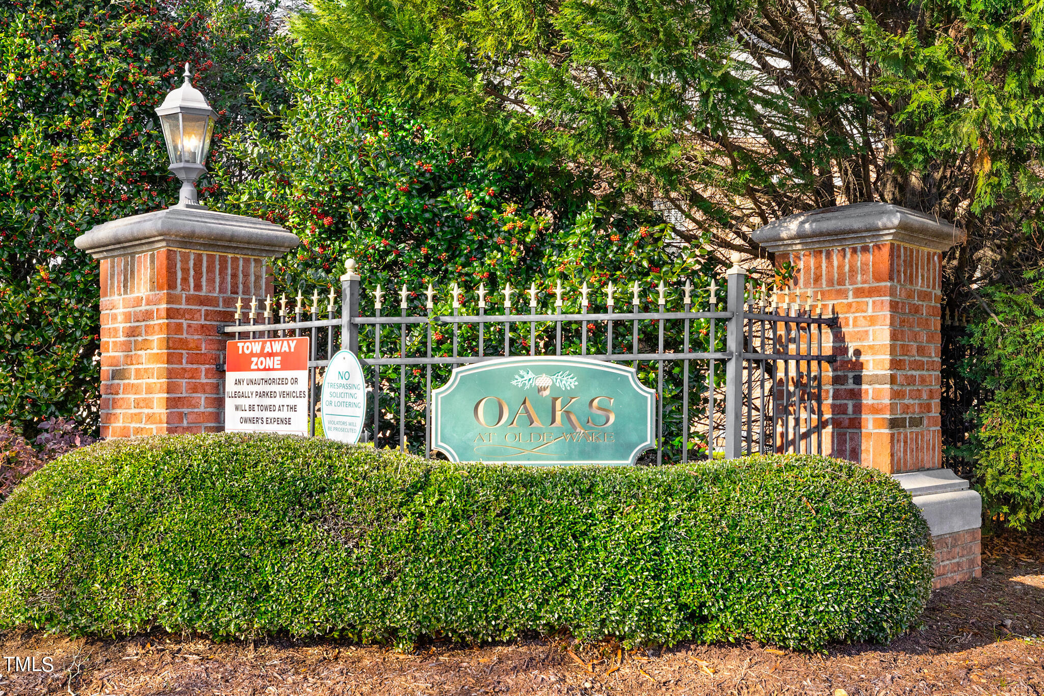 1700 Tiffany Bay Court, Unit 303 Raleigh, NC 27609 - Photo 30 of 30 a view of front a house with a garden