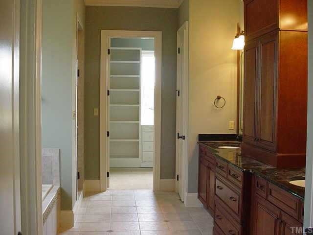 3208 Cotten Road, Unit LOT89 Raleigh, NC 27603 - Photo 9 of 12 Master bath is fabulous, with tile flooring, jetted tub, separate shower, granite double vanities, lots of cabinets and a great walk-in closet! Other