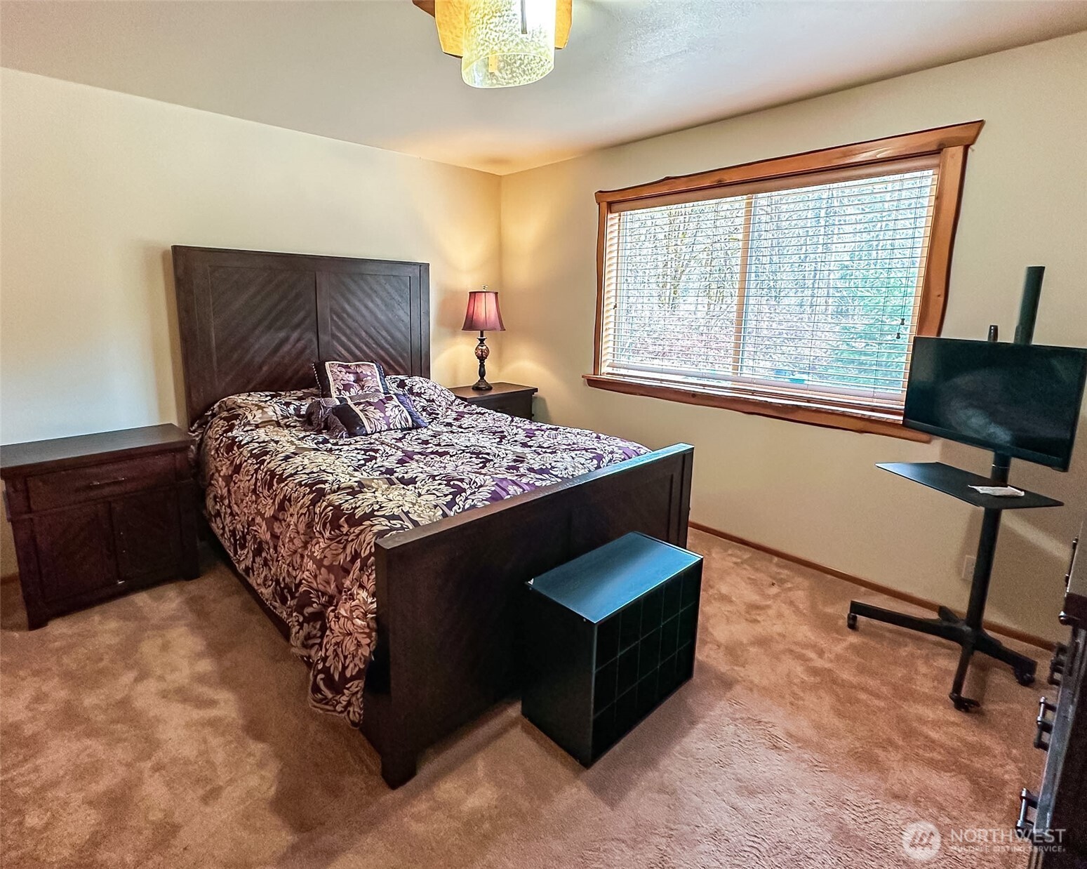 132 Findley Road Morton, WA 98356 - Photo 12 of 28 a bedroom with a bed a table and chair