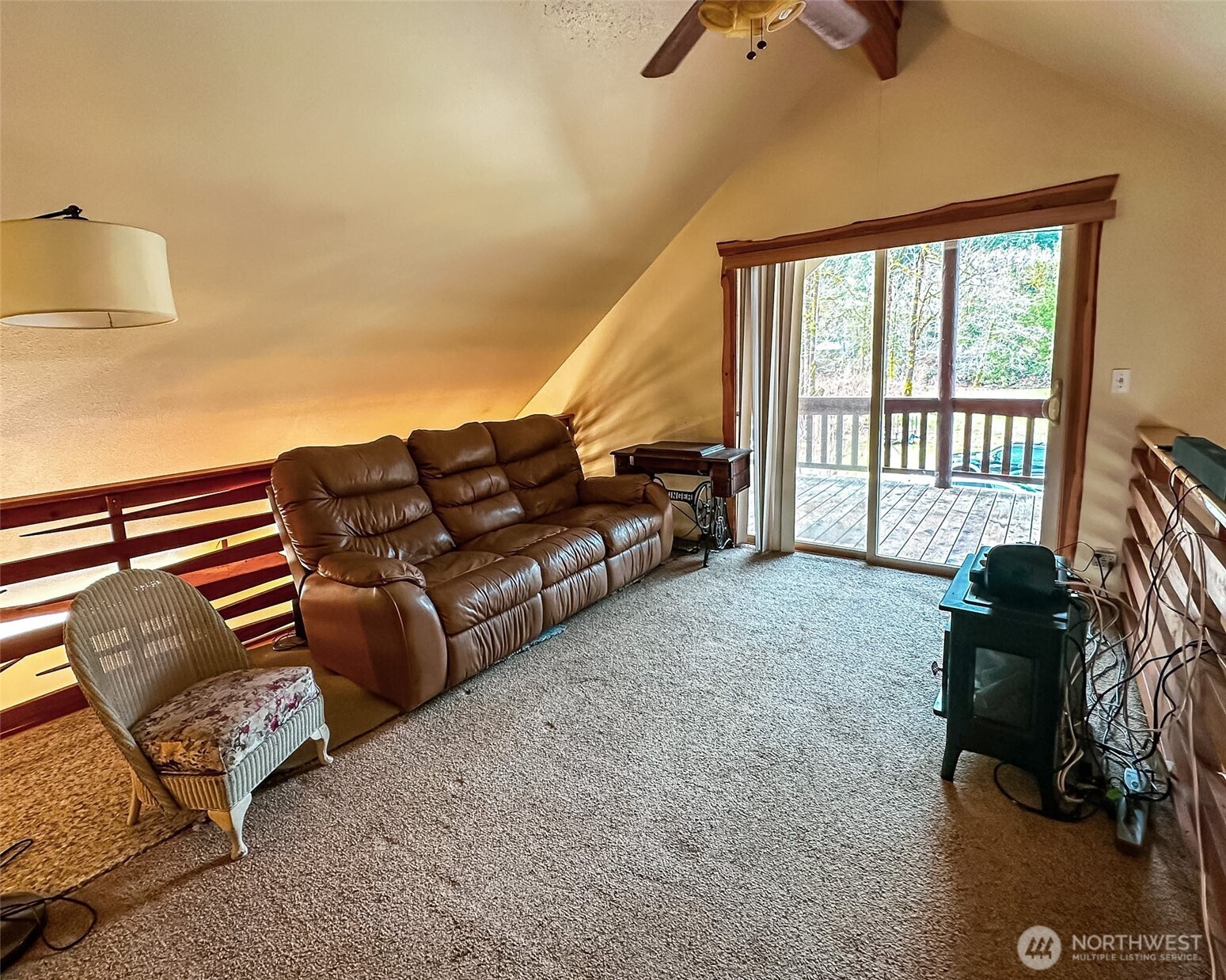 132 Findley Road Morton, WA 98356 - Photo 16 of 28 a living room with furniture and a floor to ceiling window