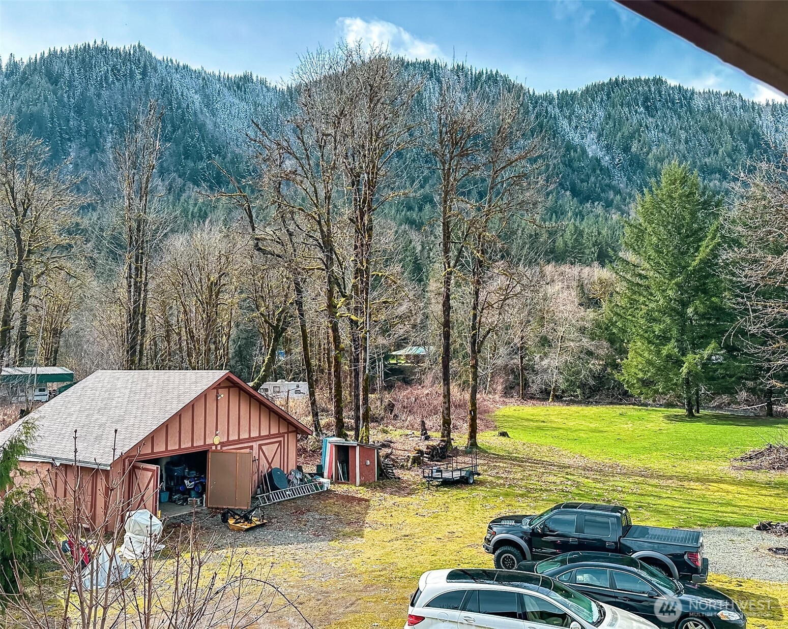132 Findley Road Morton, WA 98356 - Photo 19 of 28 a view of a house with swimming pool and sitting area