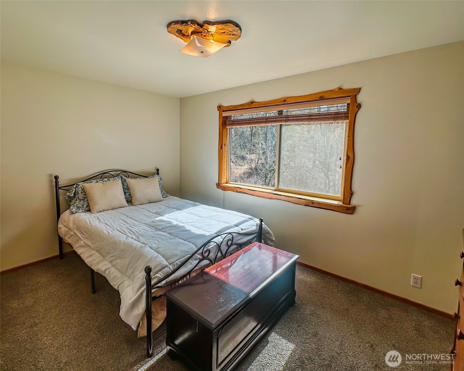 132 Findley Road Morton, WA 98356 - Photo 6 of 28 a bedroom with a bed and a window
