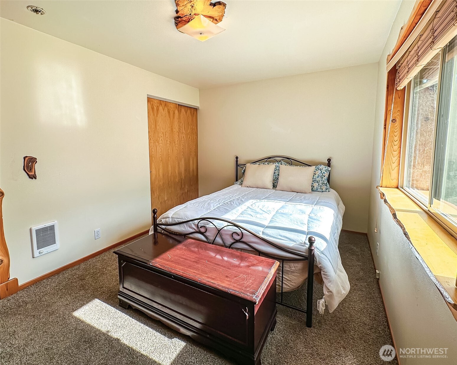 132 Findley Road Morton, WA 98356 - Photo 7 of 28 a bedroom with a bed and a window