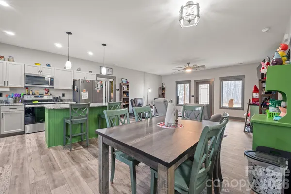 a view of a dining room with furniture and a livingroom