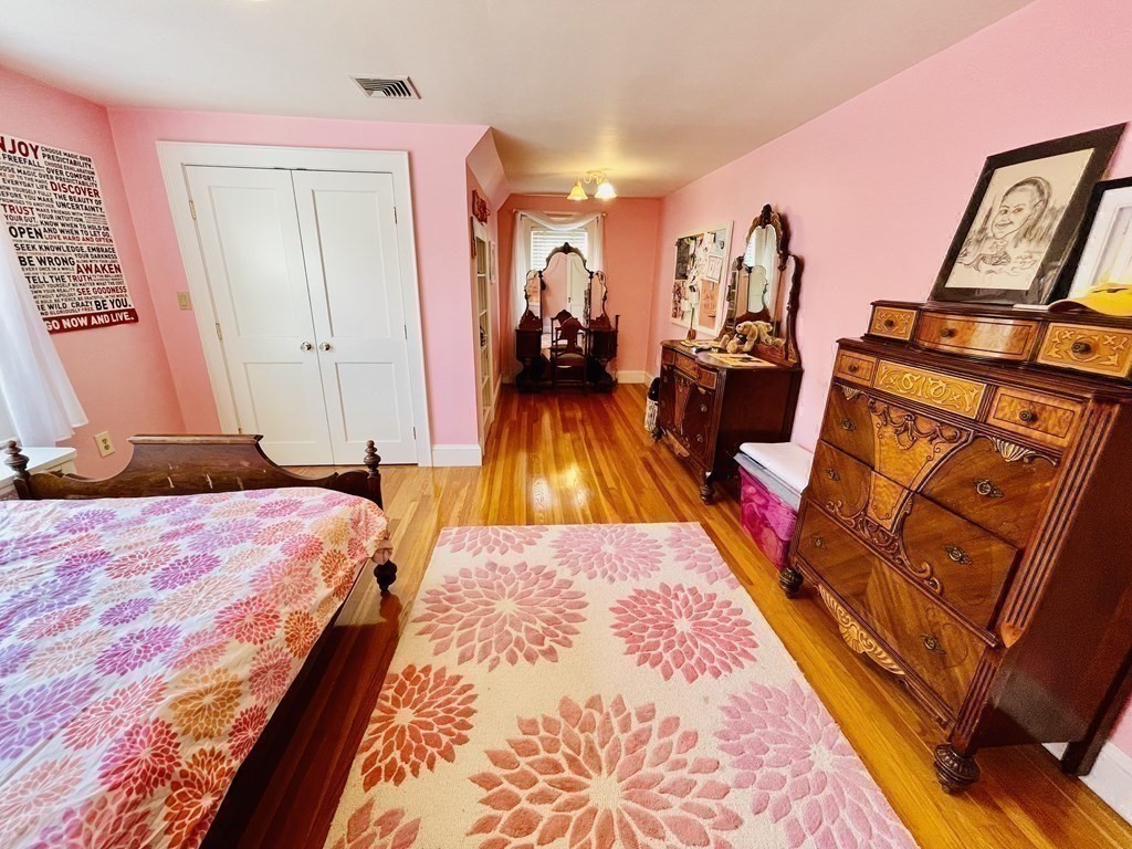 7 Stevens Road Needham, MA 02492 - Photo 26 of 42 a bed room with a bed and a mirror
