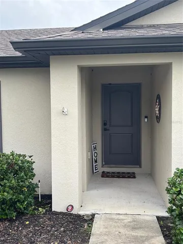 a living room with lots of furniture and a large window