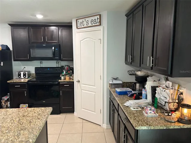 a living room with furniture and air hockey table