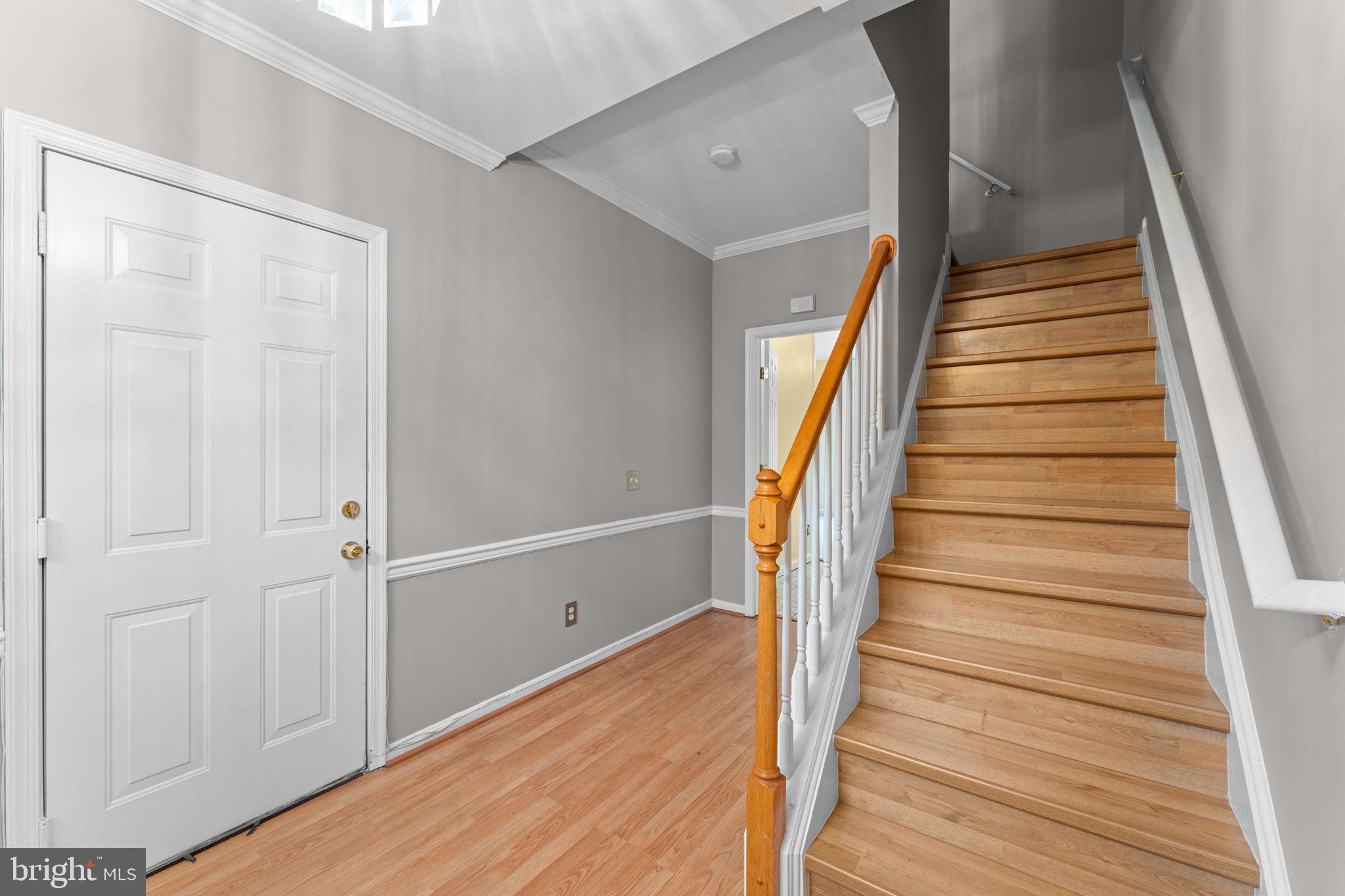 3546 Ellerton Road Bowie, MD 20716 - Photo 5 of 87 Natural wood floors in hall and on staircase.