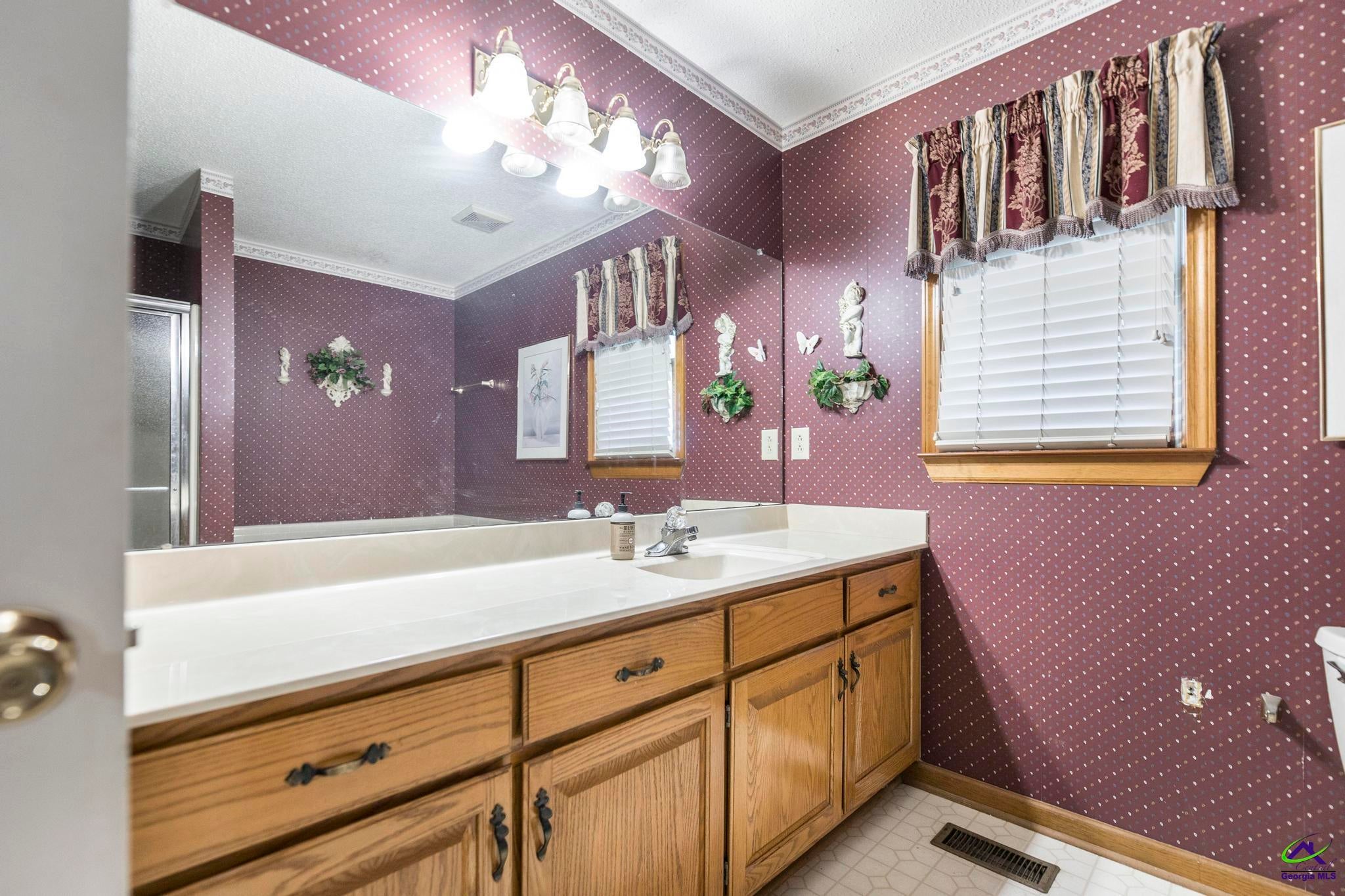 5731 School Road Macon, GA 31216 - Photo 21 of 33 Large vanity with plenty of storage space.