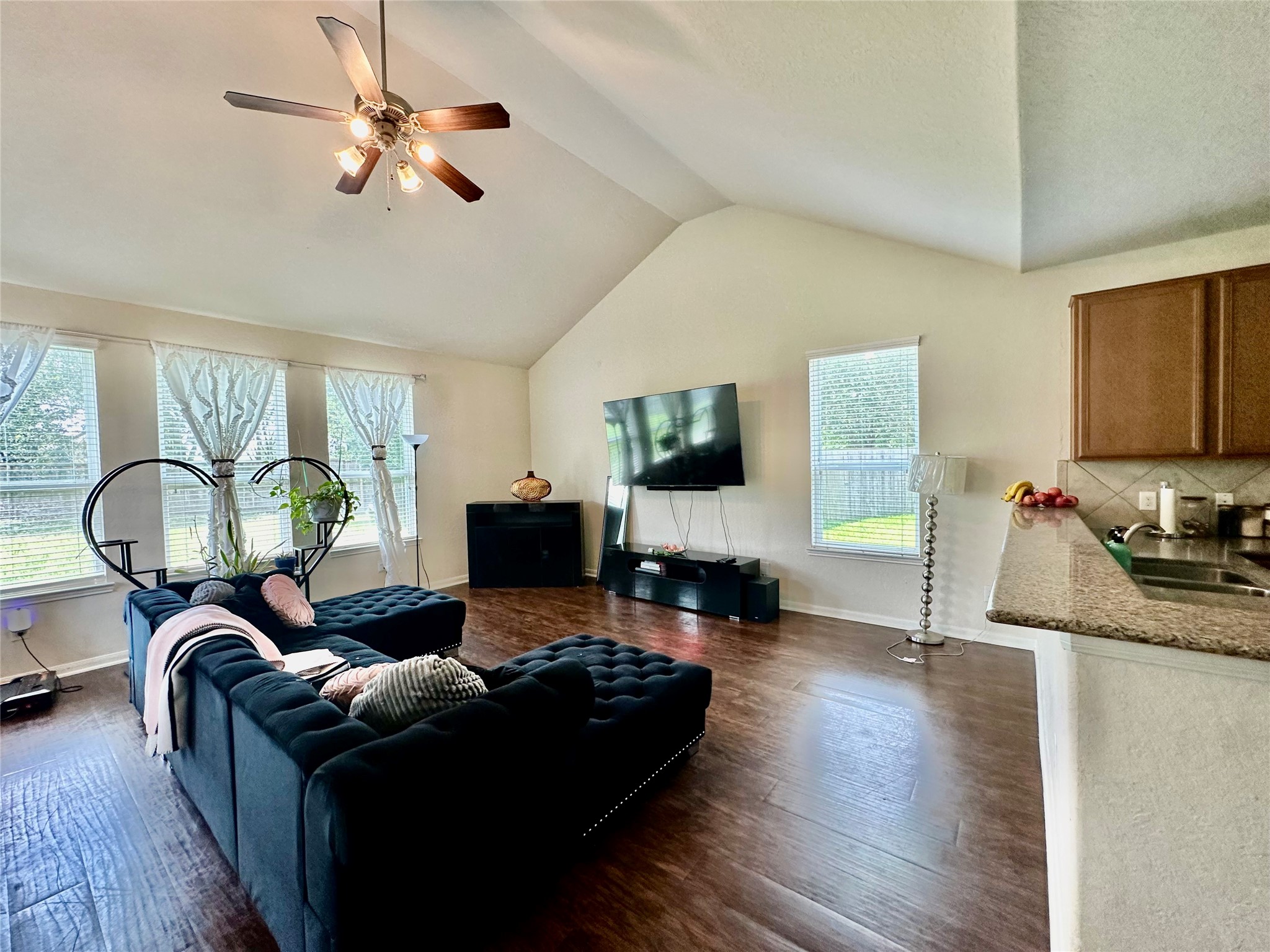 18622 Each Elm Way Houston, TX 77084 - Photo 2 of 35 a living room with furniture fireplace and a flat screen tv