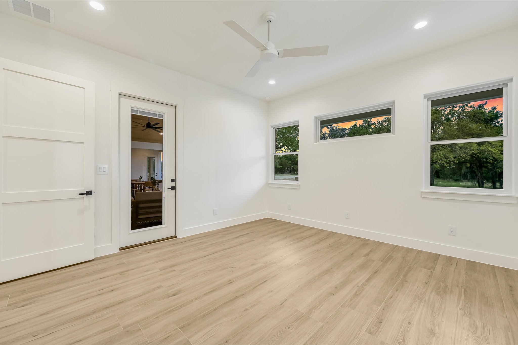 410 Shady Tree Drive Georgetown, TX 78633 - Photo 20 of 40 Empty room with light wood-style flooring, ceiling fan, and recessed lighting