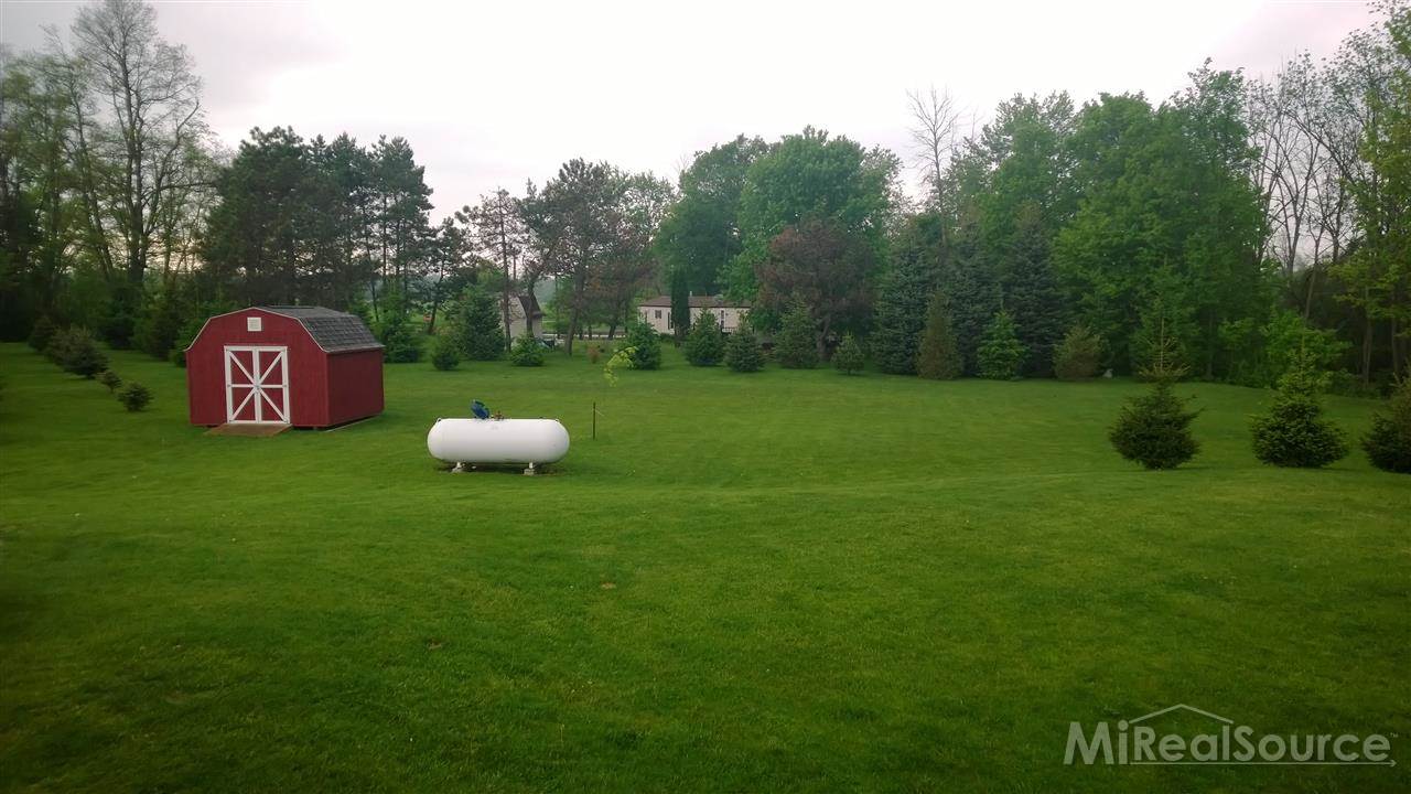 8458 Jorden Road Yale, MI 48097 - Photo 6 of 30 This is a view of the shed and the yard.