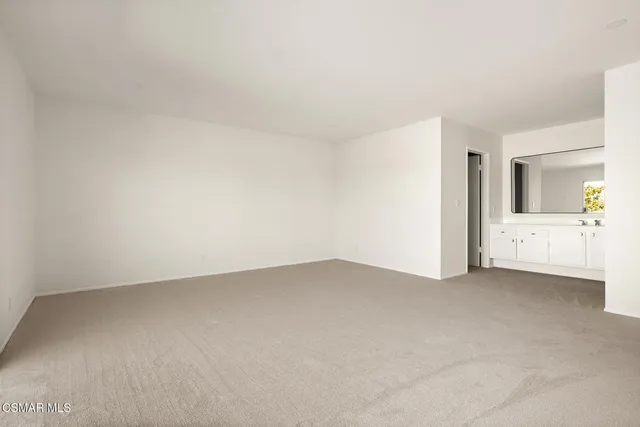 an empty room with a bathroom