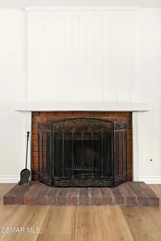 a view of a house with wooden floor and a potted plant