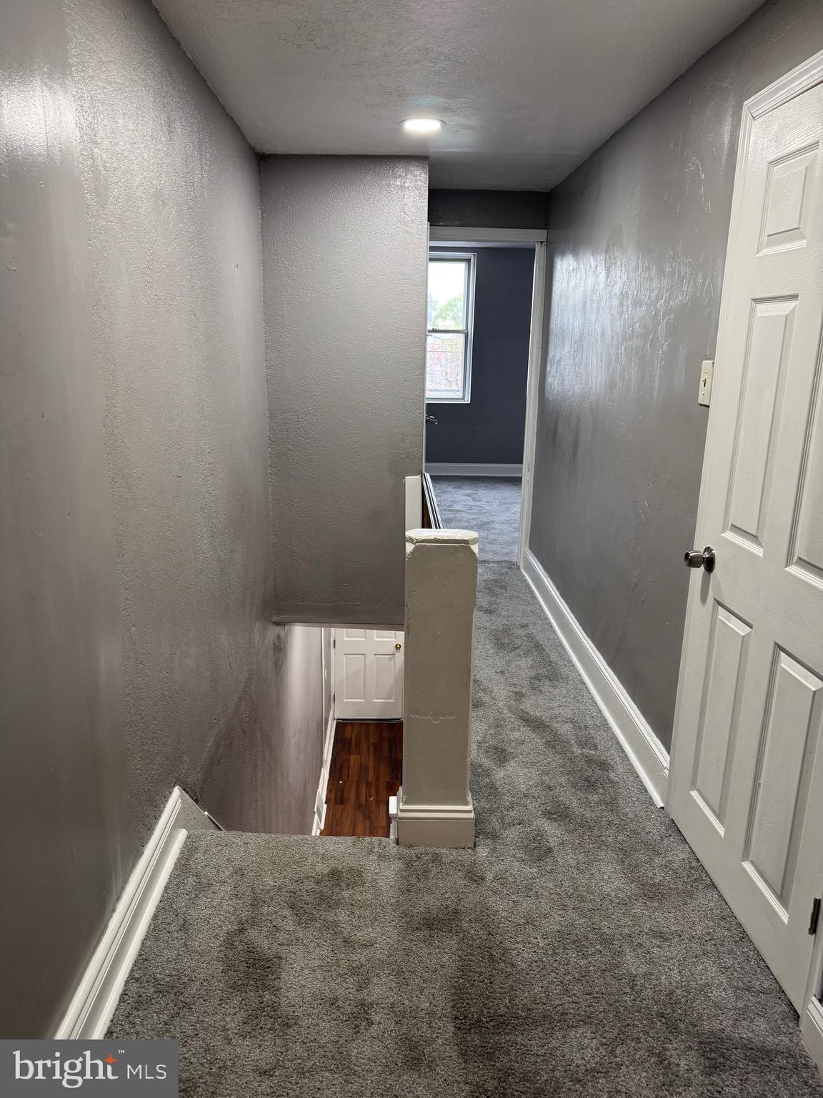 132 Walnut Street Colwyn, PA 19023 - Photo 29 of 43 an empty room with wooden floor and windows