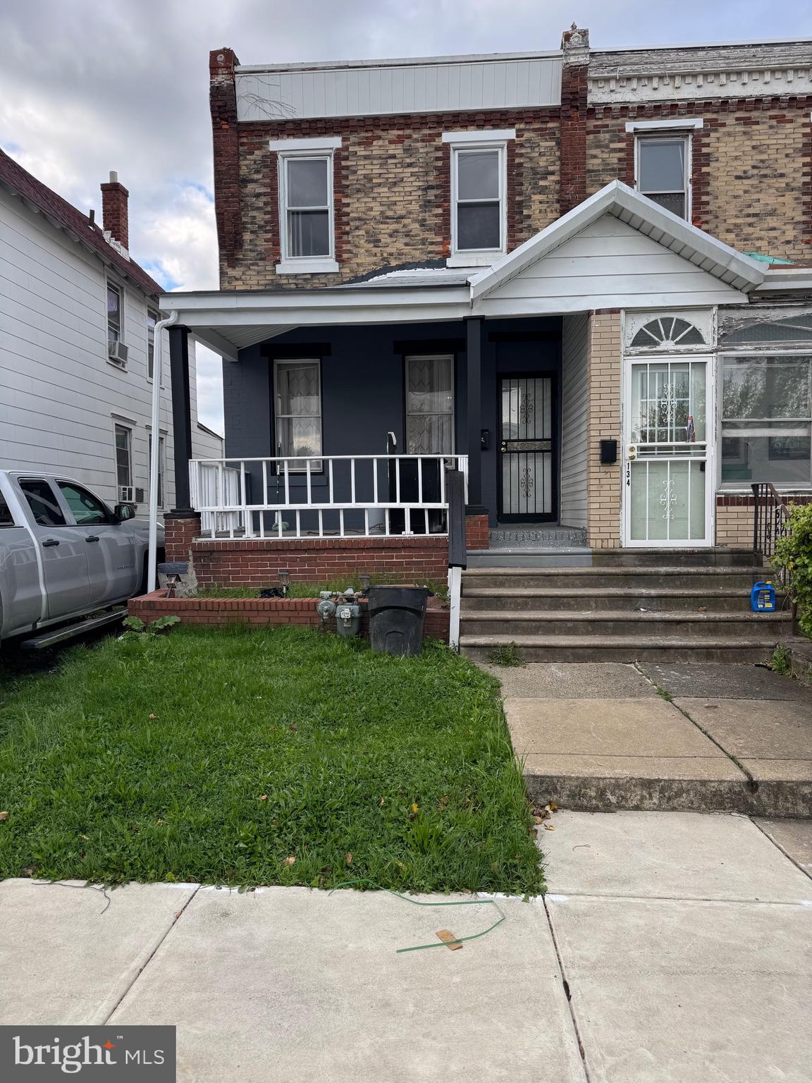 132 Walnut Street Colwyn, PA 19023 - Photo 3 of 43 front view of a house with a yard