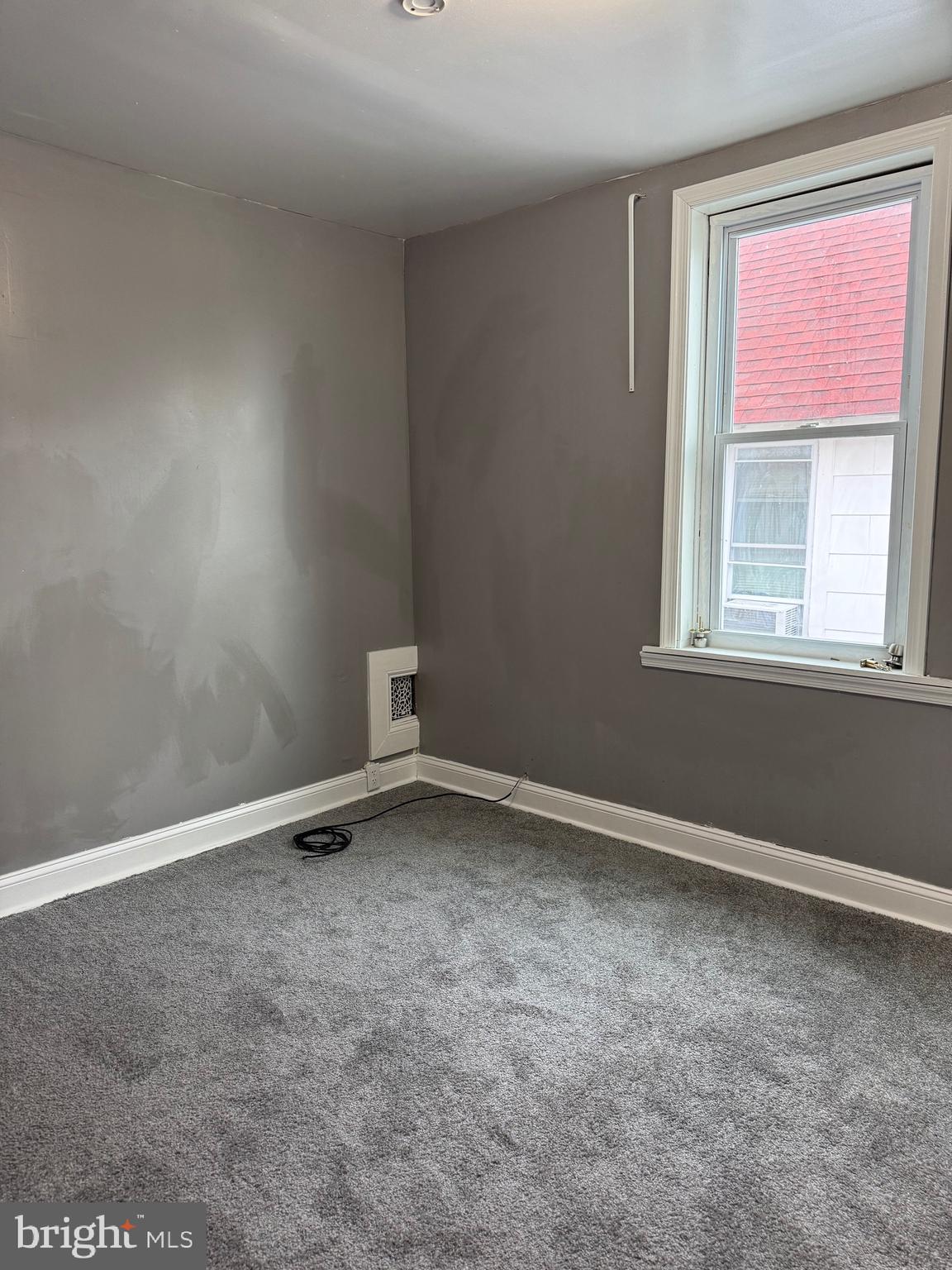 132 Walnut Street Colwyn, PA 19023 - Photo 33 of 43 an empty room with a window