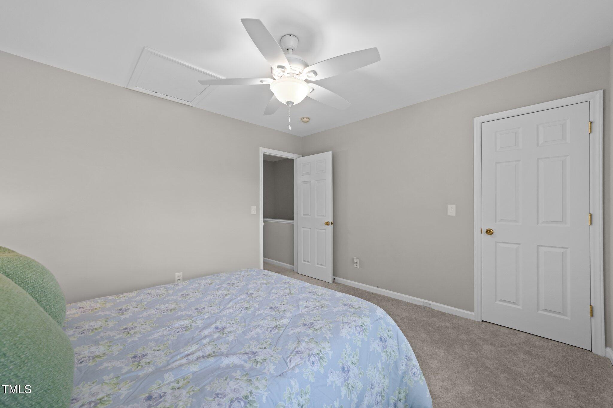 5717 Corbon Crest Lane Raleigh, NC 27612 - Photo 24 of 36 a view of a livingroom with a ceiling fan