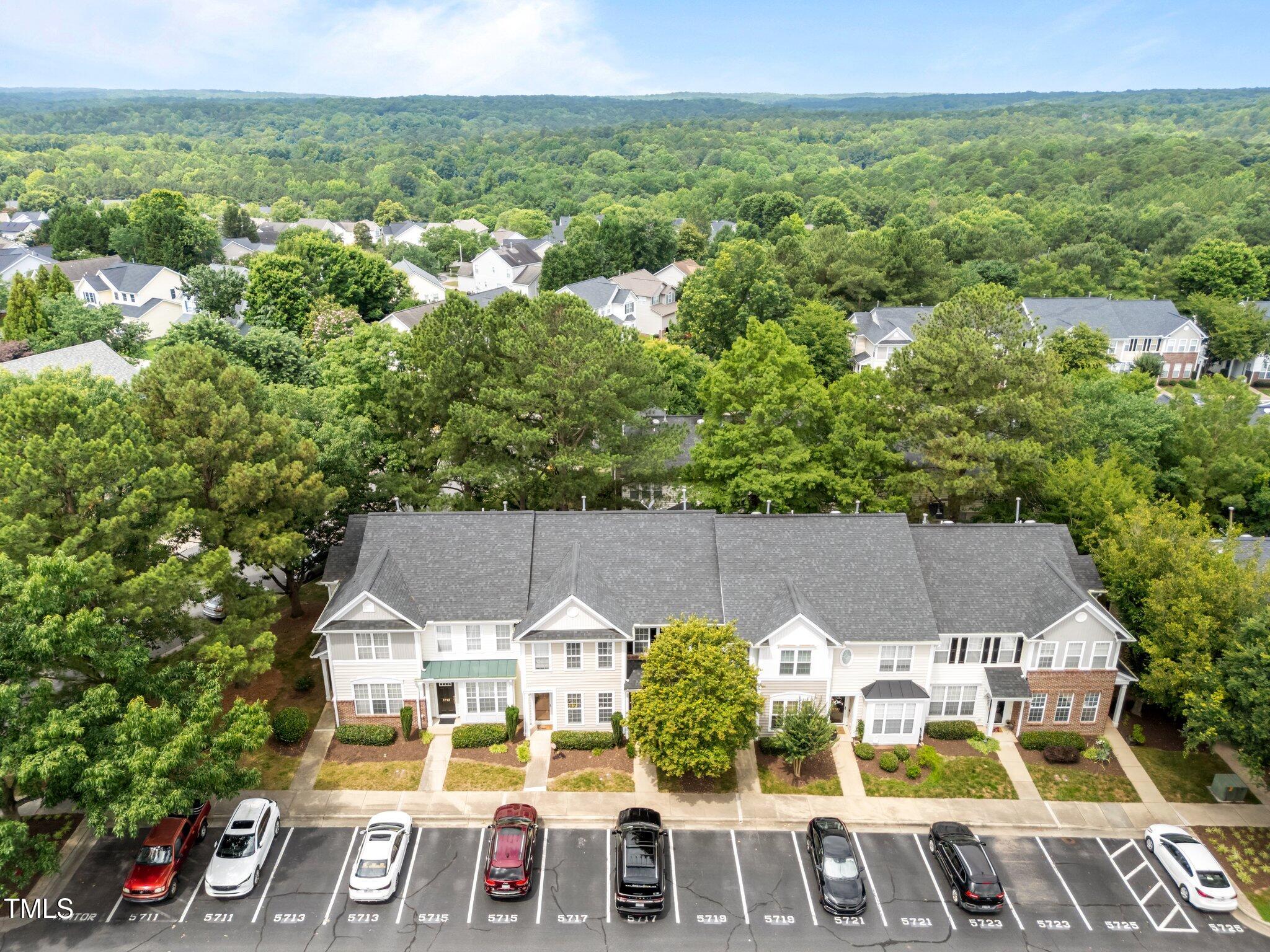 5717 Corbon Crest Lane Raleigh, NC 27612 - Photo 34 of 36 an aerial view of residential houses with outdoor space and trees