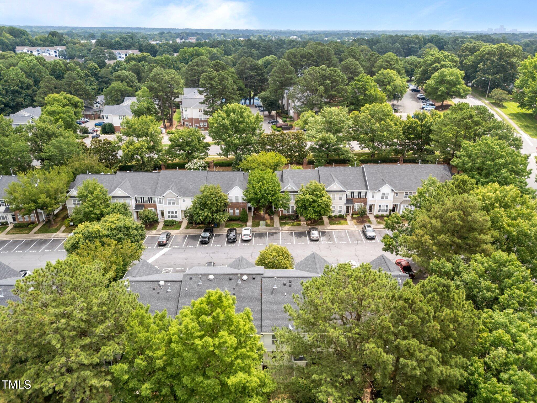5717 Corbon Crest Lane Raleigh, NC 27612 - Photo 4 of 36 an aerial view of residential houses with outdoor space and street view