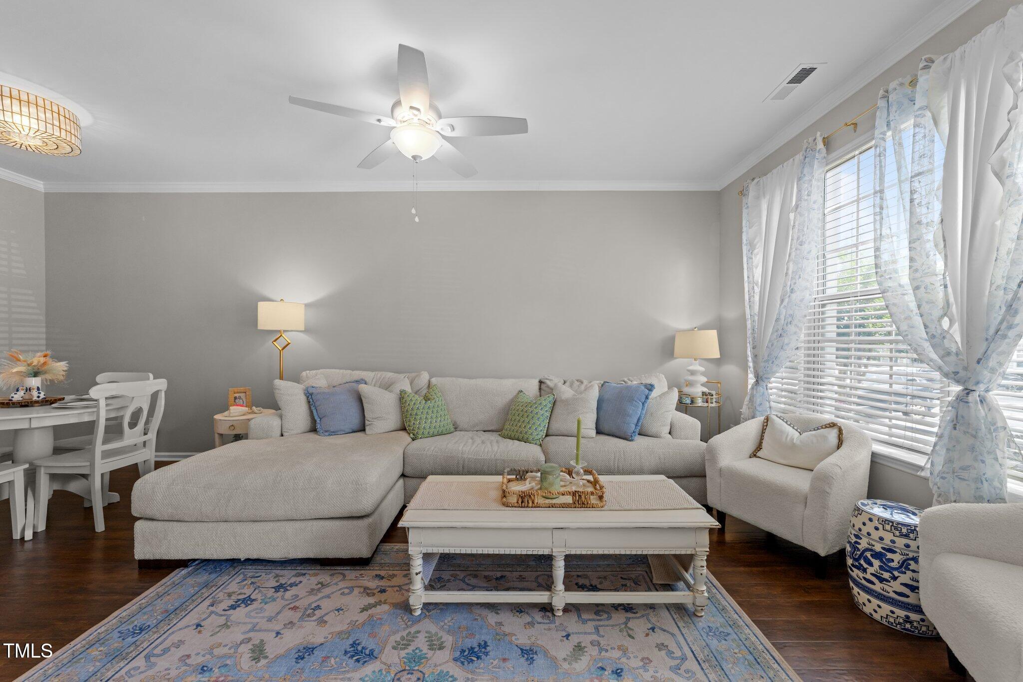 5717 Corbon Crest Lane Raleigh, NC 27612 - Photo 10 of 36 a living room with furniture lamp and window